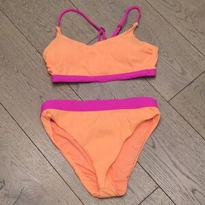 Woman’s WB pink/melon bikini. Medium. Biker strap back. Never worn! Cute!